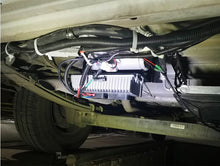 Cargar imagen en el visor de la Galería, Installed RV air conditioner unit with bundled wiring and compact control module under the vehicle