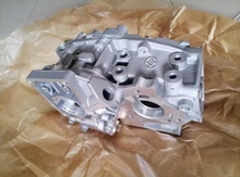 Load image into Gallery viewer, Engine oil pump assembly with metal housing and mounting brackets, gray finish by SUONAMA .
