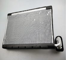 Load image into Gallery viewer, Car HVAC evaporator core with silver fins and white bracket fitting
