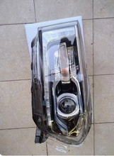 Load image into Gallery viewer, Left-side chrome and dark housing vehicle headlight with round projector and reflector
