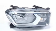 Load image into Gallery viewer, Front view chrome vehicle headlight with clear lens and projector-style bulb
