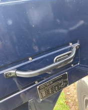 Load image into Gallery viewer, Interior door handle with mounting hardware, silver on blue panel

