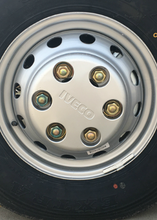 Load image into Gallery viewer, Wheel cover installed on silver rim with black center and gold hub fasteners
