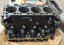 Load image into Gallery viewer, Engine cylinder block showing four cylinder bores and row of mounting holes
