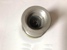 Load image into Gallery viewer, Speed sensor top view with circular metal rim and black center insert

