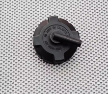 Load image into Gallery viewer, Black expansion tank cap with vented center and raised markings on top
